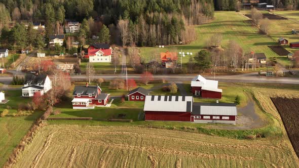 Beautiful Red Coutryside Farm Houses And Buildings Near Ostersund, Sweden. 4K Drone.