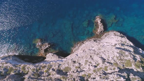 Transparent sea water near stony remote coast