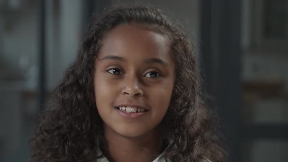 Charming Little Girl with Playful Smile Flirting alt