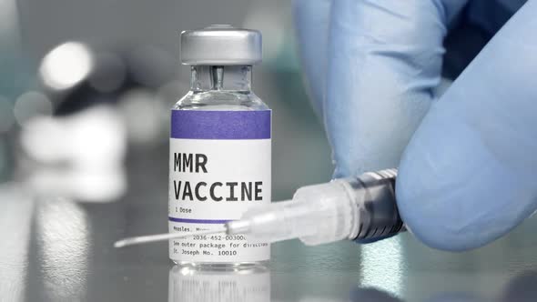 MMR vaccine vial in medical lab with syringe