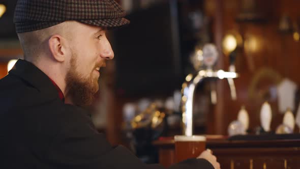 Bartender Serves Light Delicious Drink To Male Client at Bar