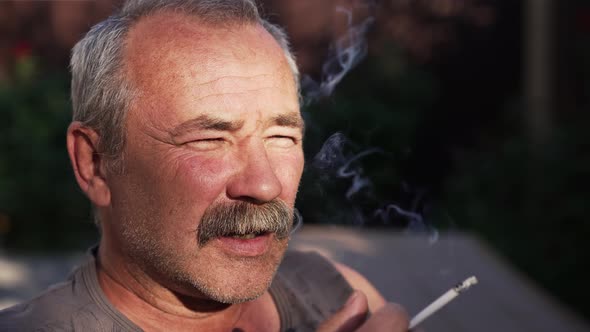 Smoking Mature Man with Mustaches