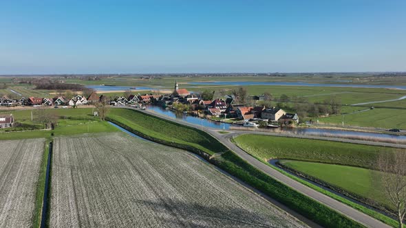 Small Historic Typical Dutch Polder Farm Village in Green Countryside Sunny Spring Landscape with