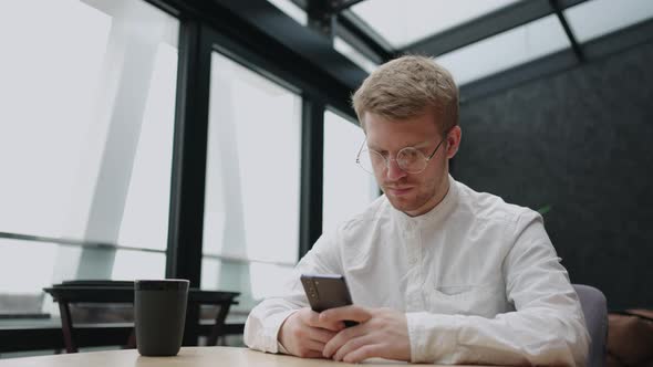 Problematic Internet Use of Modern People Adult Man is Reading News in Social Media Surfing Internet