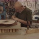 Luthier filing a guitar mold - VideoHive Item for Sale