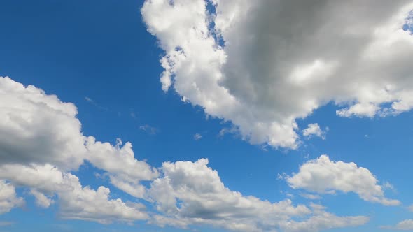 4K Sky Time lapse, Beautiful background, Sky Timelapse of skyscrapers, Blue sky with clouds and sun.