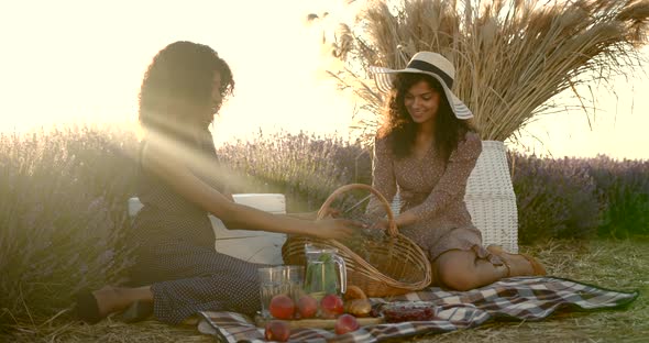 Two Mulriracial Women on Picnic in Lavender Field