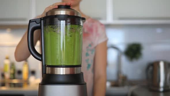 Woman Making Green Smoothies with Blender in Home Kitchen, Healthy Eating Lifestyle Concept