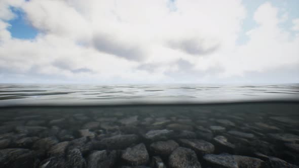 Ocean Seascape with Sky and Ocean Wave Splitted By Waterline to Underwater Part