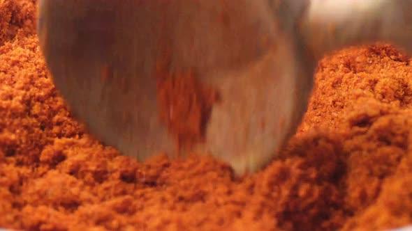 Chili Powder and Spoon in a Bowl Close Up