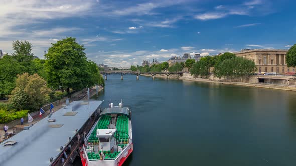 Touristic Boat Passes Below Pont Des Arts and Stop on Boat Station on Seine River Timelapse