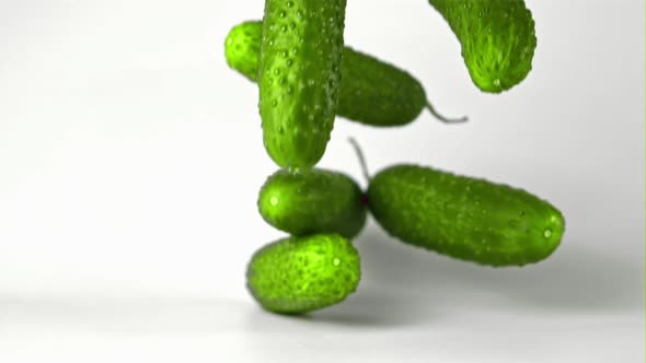 Super Slow Motion Fresh Cucumbers Fall on the Table