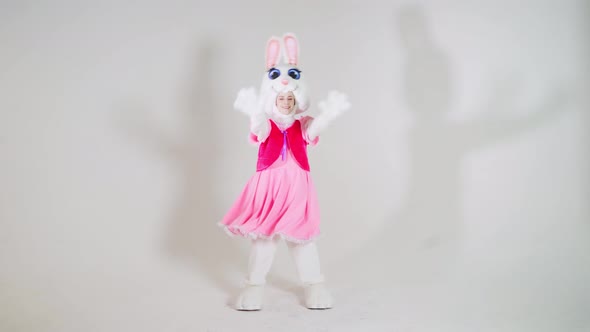 Portrait of a young cute girl in a beautiful hare costume