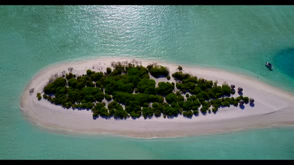 Aerial flying over texture of perfect coastline beach adventure by aqua blue ocean with white sand b
