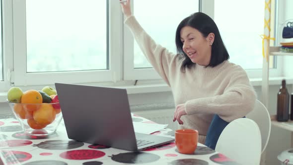 Caucasian woman video calling on laptop computer, streaming online webinar training