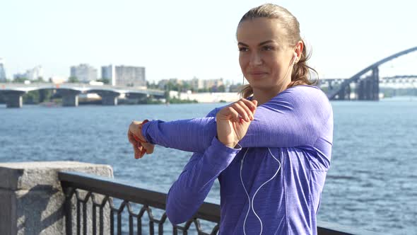 Woman Switches Her Gaze While Stretching and Warming Up