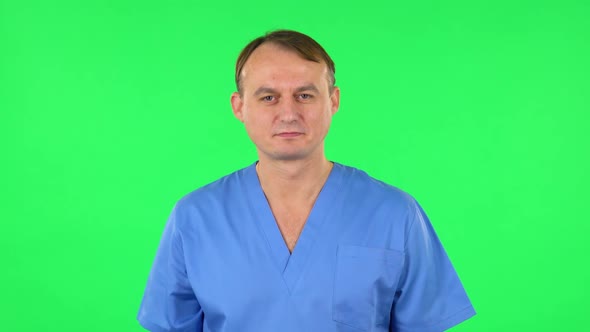 Medical Man Pointing Up Fingers. Green Screen