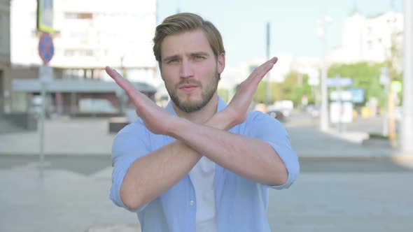 Portrait of Rejecting Man Doing No Gesture Outdoor