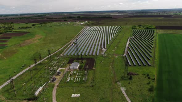 Long Rows of the Solar Panels in a Green Field, Eco Friendly Energy, 