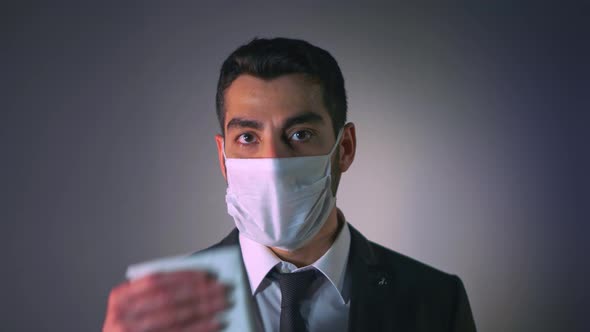 Stressed Businessman in Face Mask (4K)