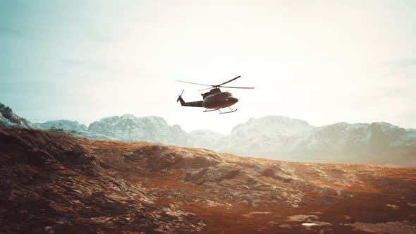 Slow Motion Vietnam War Era Helicopter in Mountains