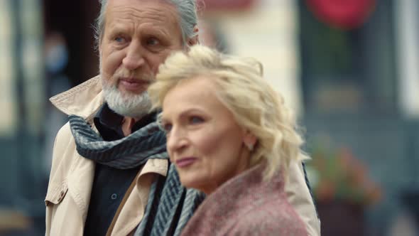 Elderly Couple Walking Down the Street