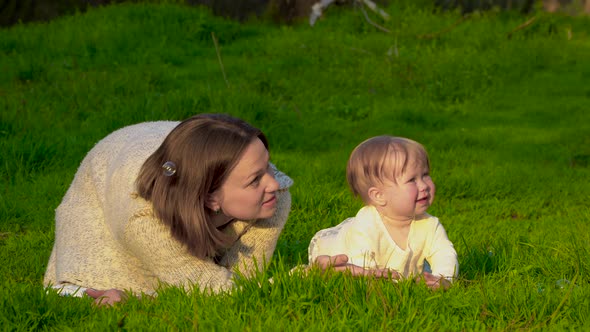 Mom with Her Daughter in the Park