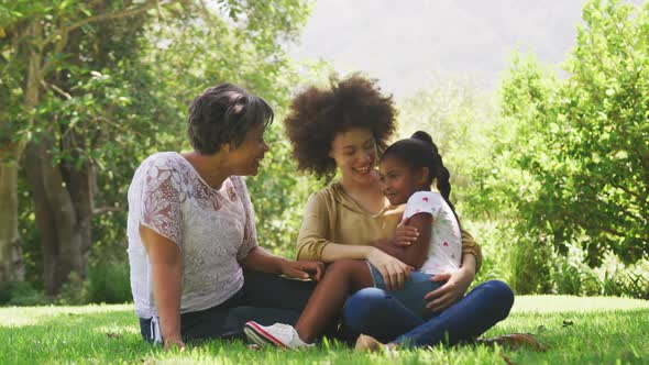 Mixed race woman spending time with her mother and her daughter