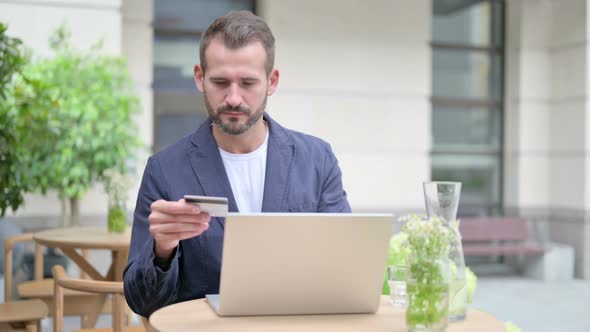 Man Making Successful Online Payment on Laptop