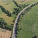 Drone filming of the Carpathian mountains in Ukraine. Cars are driving along the winding road - VideoHive Item for Sale