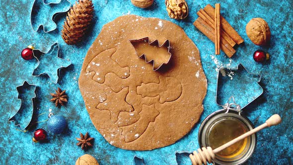 Christmas Baking Concept. Gingerbread Dough with Different Cutter Shapes