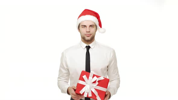 Businessman Giving Present To Camera Over Isolated White Background.