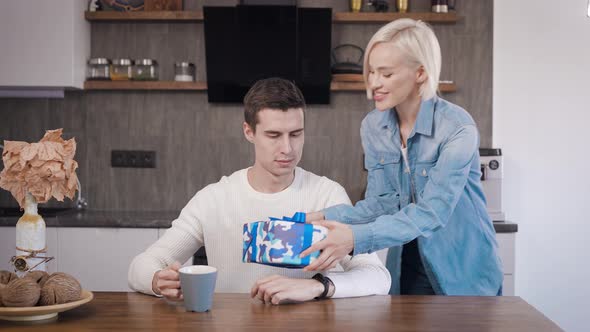 Young Beautiful Couple at Home in the Kitchen