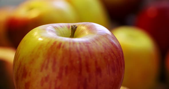 A ripe red-yellow apple rotates around its axis