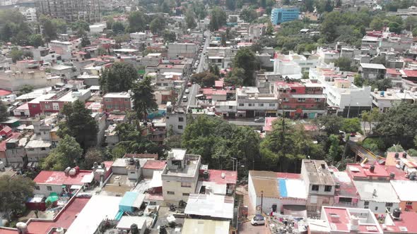 Aerial view of the houses at Barrio La Concepció at southern Mexico City. Drone flying sideways.