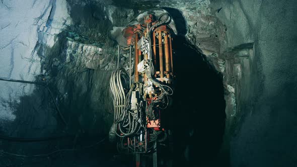 Boring Machine is Irrigating Walls of an Underground Mine