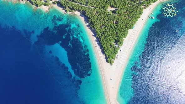 Flying over of the sandy beach Zlatni rat on the island of Brac, Croatia