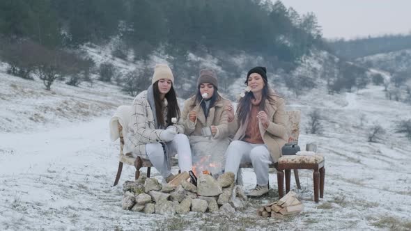 Women Dressed Warmly in Winter Park in the Fresh Frosty Air Roasted Marshmallow