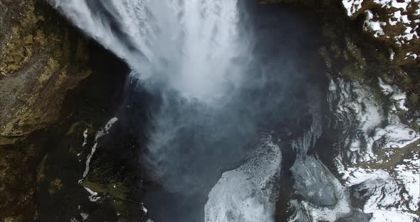 Powerful waterfall in snowy countryside