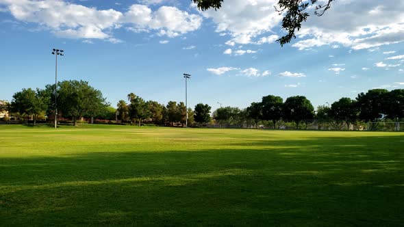 City park panorama reveals mountain background in a suburban community