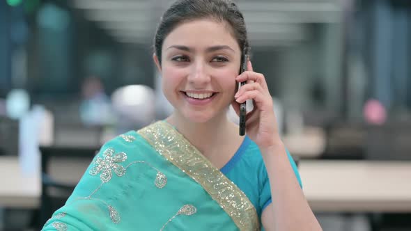 Young Indian Woman Talking on Smartphone