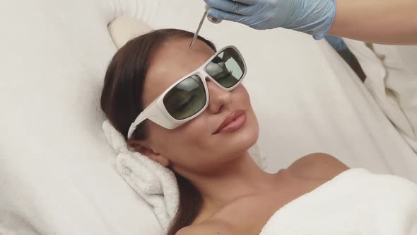 Happy Woman with Perfect Skin Having Erbium Laser Theraphy