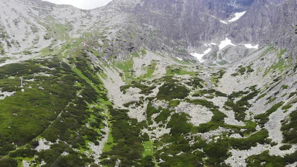 Reveal Shot of a Valley with a blue lake near the Mountain in Slovakia