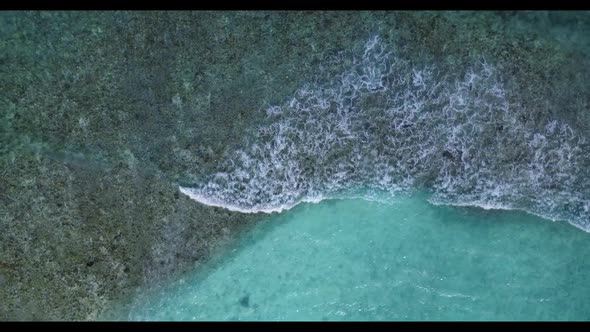 Aerial top view seascape of relaxing resort beach voyage by turquoise lagoon and white sand backgrou