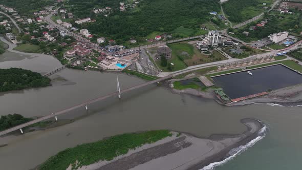 Anaklia, Georgia - July 16 2022: Aerial view of Anaklia-Ganmuhkuri Pedestrian Bridge at sunset