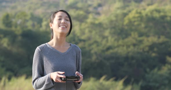 Woman wearing winter jacket and use of mobile phone at outdoor