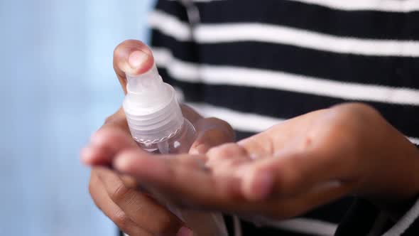 Close Up of Young Man Hand Using Hand Sanitizer Spray