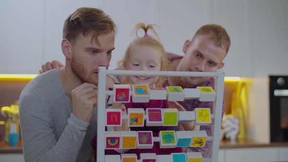 Same Sex Parents Helping Kid Learning Abc Home