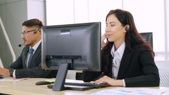 Business People Wearing Headset Working in Office