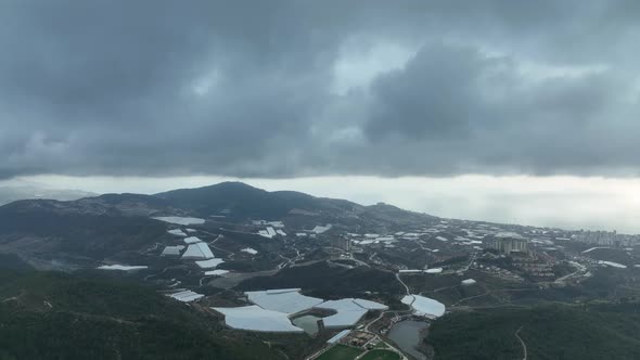 Over the city in the clouds aerial view 4 K